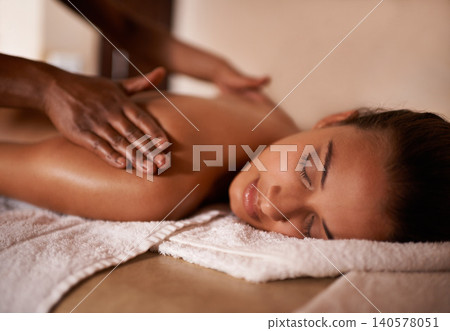 Hands, woman and sleep at spa for massage, wellness and skin care for back, chiropractic therapy or peace. Female person, relax and health for lifestyle, body or wellbeing on table, calm or natural 140578051