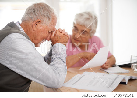 Old couple, stress and document for insurance in home for retirement planning for financial budget, problem or investment. Elderly man, woman and unhappy with paperwork for saving, debt or crisis Old couple, stress and document for insurance in home for retirement planning for financial budget, problem or investment. Elderly man, woman and unhappy with paperwork for saving, debt or crisis 140578141
