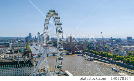 Drone point of view on downtown of London : The London Eye, Westminster Abbey in the background and the River Thame Drone point of view on downtown of London : The London Eye, Westminster Abbey in the background and the River Thame 140578164