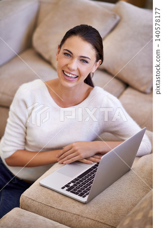 Woman, portrait and laptop for remote work on website, home and smile for copywriting or blog. Female person, living room and laughing for research on article, information and app for networking Woman, portrait and laptop for remote work on website, home and smile for copywriting or blog. Female person, living room and laughing for research on article, information and app for networking 140578177