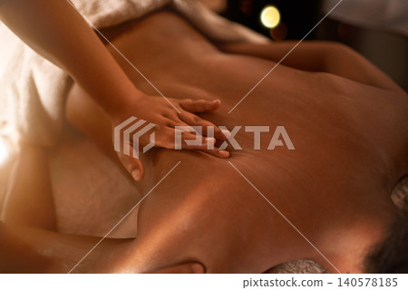 Masseuse, hand and massage on bed at spa for hospitality, stress relief and luxury wellness in hotel. Relax, physical therapy and zen client with peace for vacation, holiday and calm body care Masseuse, hand and massage on bed at spa for hospitality, stress relief and luxury wellness in hotel. Relax, physical therapy and zen client with peace for vacation, holiday and calm body care 140578185