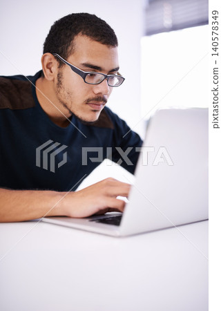 Elearning, glasses and man typing on laptop for research, study or opportunity for university education. Computer, knowledge and college student with online course for programming, software or coding 140578349