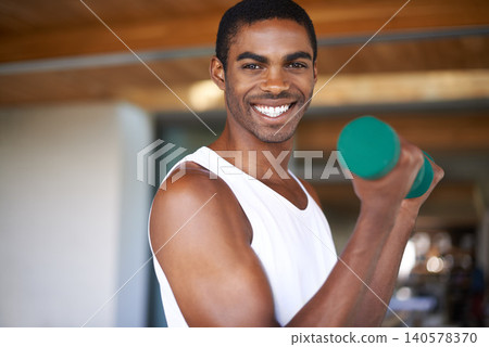 Black man, smile and training with dumbbell for exercise, bodybuilding and performance goals. African person, portrait and equipment with lifting weights for wellness, strength and healthy body Black man, smile and training with dumbbell for exercise, bodybuilding and performance goals. African person, portrait and equipment with lifting weights for wellness, strength and healthy body 140578370