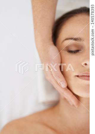 Woman, hand and massage treatment for face wellness at holiday resort for spa vacation, relaxing or skincare. Female person, masseuse and fingers in Hawaii for dermatology cosmetics, beauty or above Woman, hand and massage treatment for face wellness at holiday resort for spa vacation, relaxing or skincare. Female person, masseuse and fingers in Hawaii for dermatology cosmetics, beauty or above 140578393