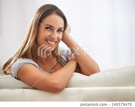 Smile, portrait and happy woman on sofa, relax or calm at home, house or living room in Canada. Female person, lady or gen z girl resting in apartment, hotel or lounge for weekend, day off or holiday Smile, portrait and happy woman on sofa, relax or calm at home, house or living room in Canada. Female person, lady or gen z girl resting in apartment, hotel or lounge for weekend, day off or holiday 140578478