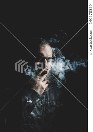 Man Smoking Cigar in Cinematic Studio Lighting. Man Smoking Cigar in Cinematic Studio Lighting. 140578530