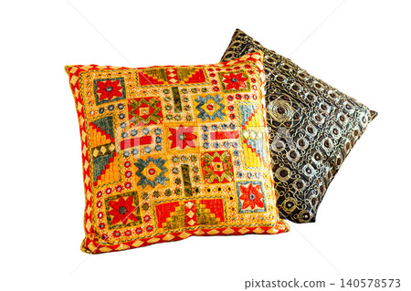 Two ethnic-style decorative cushions with traditional embroidery on a white background. Two ethnic-style decorative cushions with traditional embroidery on a white background. 140578573