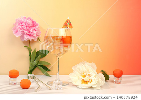Royal lemonade cocktail with tequila, gin, rum, ice and fresh apricot berries, bar and party concept with peonies, restaurant and cafe advertising card, minimal still life with flowers and alcohol, Royal lemonade cocktail with tequila, gin, rum, ice and fresh apricot berries, bar and party concept with peonies, restaurant and cafe advertising card, minimal still life with flowers and alcohol, 140578924