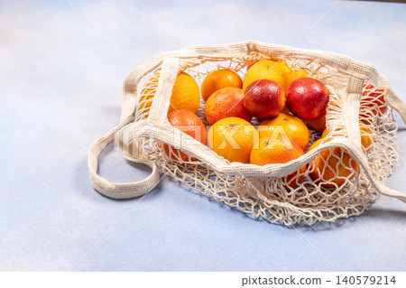 Citrus fruits and blood oranges in reusable net bag Citrus fruits and blood oranges in reusable net bag 140579214