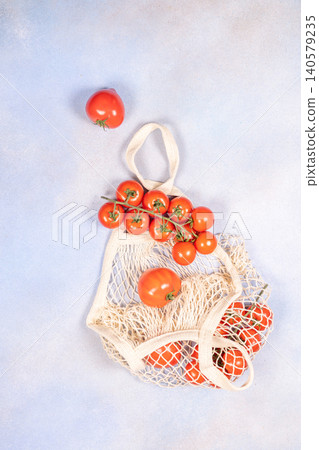 Fresh ripe tomatoes in reusable mesh bag Fresh ripe tomatoes in reusable mesh bag 140579235