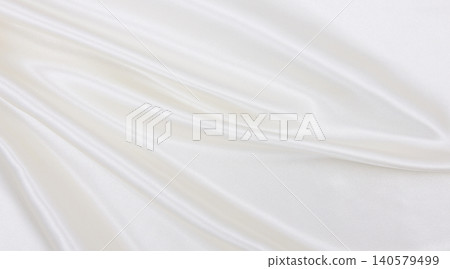 Smooth elegant white silk or satin luxury cloth texture as wedding background. Luxurious background design 140579499