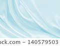 Smooth elegant blue silk or satin luxury cloth texture as abstract background. Luxurious background design 140579503
