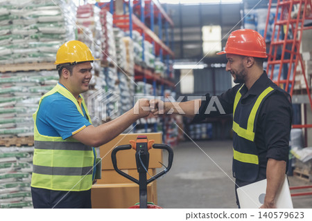 Diversity Teamwork Warehouse worker fist bump together trust partner. Engineer man, women hands partnership. Coworker colleague logistics Warehouse agreement. Multiracial Two people fist bump partner Diversity Teamwork Warehouse worker fist bump together trust partner. Engineer man, women hands partnership. Coworker colleague logistics Warehouse agreement. Multiracial Two people fist bump partner 140579623