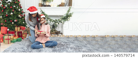 Banner Two Women sibling using hands decorate Christmas tree red ball bauble. Close up hands holding red ball bauble decorate. Asian woman friends decorate christmas tree xmas holiday with copy space Banner Two Women sibling using hands decorate Christmas tree red ball bauble. Close up hands holding red ball bauble decorate. Asian woman friends decorate christmas tree xmas holiday with copy space 140579714