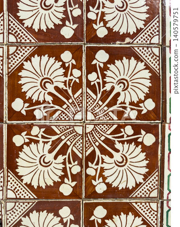 Close-up of vintage brown and white floral tiles Close-up of vintage brown and white floral tiles 140579751