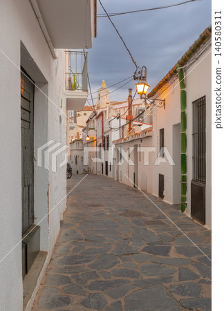 Narrow Stone Street with White Houses in Cadaques Catalonia Spain at Dawn Narrow Stone Street with White Houses in Cadaques Catalonia Spain at Dawn 140580311