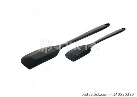 set of two black cooking spatulas on a white background set of two black cooking spatulas on a white background 140580380
