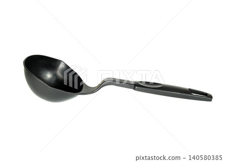 kitchen black plastic ladle lies at a slight angle on a light isolated background 140580385