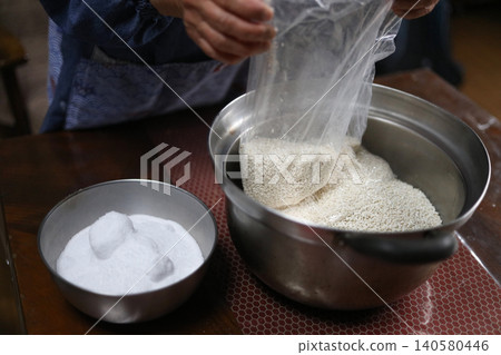 A woman making miso A woman making miso 140580446