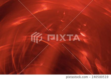 Abstract red light patterns with swirling shapes and textures creating a dynamic visual effect suitable for backgrounds or artistic projects Abstract red light patterns with swirling shapes and textures creating a dynamic visual effect suitable for backgrounds or artistic projects 140580519