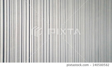 wallpaper texture with thin vertical stripes of gray and black color on a white background wallpaper texture with thin vertical stripes of gray and black color on a white background 140580582
