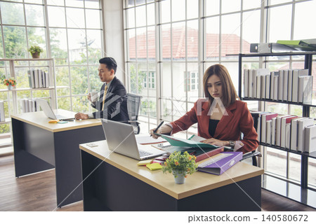 Two young businessman reading Planning analyze marketing infographic. Partners team working together. Two businesspeople meeting team discuss using laptop look at financial graph chart in office desk Two young businessman reading Planning analyze marketing infographic. Partners team working together. Two businesspeople meeting team discuss using laptop look at financial graph chart in office desk 140580672