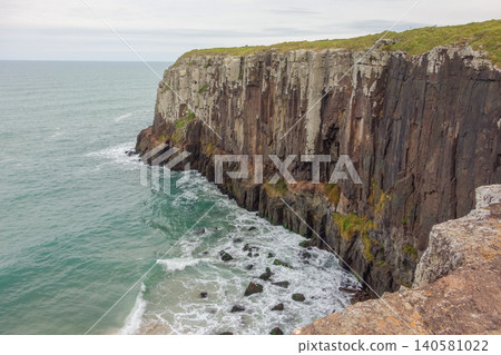 immense basalt cliffs on the beach of Torres, Rio grande do Sul, Brazil immense basalt cliffs on the beach of Torres, Rio grande do Sul, Brazil 140581022