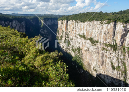 immense walls of basaltic rock forming a huge canyon. Cambara do Sul, RS, Brazil. Itaimbezinho canyon. immense walls of basaltic rock forming a huge canyon. Cambara do Sul, RS, Brazil. Itaimbezinho canyon. 140581058