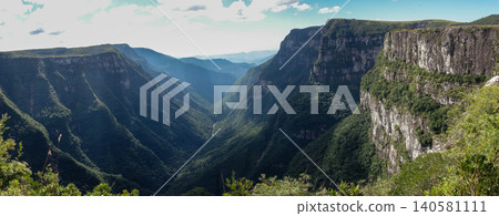 wide view of immense walls of Fortaleza canyon in Cambara do Sul, RS, Brazil. Panoramic wide view of immense walls of Fortaleza canyon in Cambara do Sul, RS, Brazil. Panoramic 140581111
