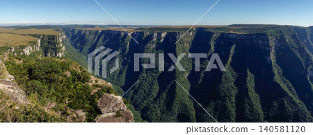 wide view of immense walls of Fortaleza canyon in Cambara do Sul, RS, Brazil. Panoramic wide view of immense walls of Fortaleza canyon in Cambara do Sul, RS, Brazil. Panoramic 140581120