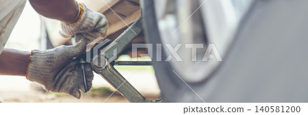 Banner Man hands fixing Car machinery vehicle mechanical service. Mechanic man hands repairing car shop. panoramaopen vehicle hood checking up auto mobile. Car maintenance engineer with copy sapce. 140581200