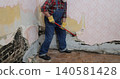 Adult worker demolish old house 140581428