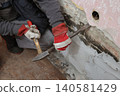 Adult worker demolish old house 140581429