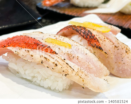 Fresh seared golden snapper nigiri Fresh seared golden snapper nigiri 140581524