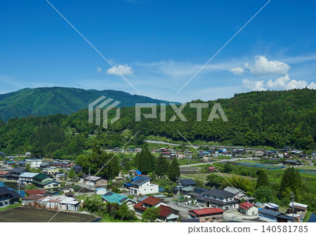 The scenery of the lush green mountains and rural townscape of Hida Takayama, a popular tourist spot in early summer. The scenery of the lush green mountains and rural townscape of Hida Takayama, a popular tourist spot in early summer. 140581785