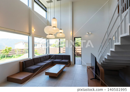 An open living room with a high ceiling An open living room with a high ceiling 140581995