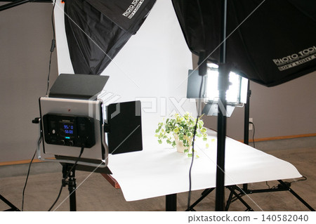 A scene of photographing objects in a studio; a creative image. A scene of photographing objects in a studio; a creative image. 140582040