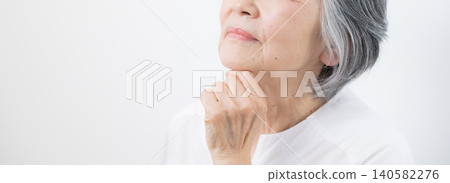 A white background with a gray-haired elderly (senior) woman contemplating pensions; faceless banner. A white background with a gray-haired elderly (senior) woman contemplating pensions; faceless banner. 140582276