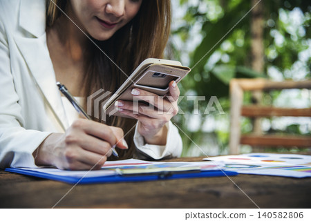 Woman hands holding mobile phone outdoor surfing internet online technology lifestyle. Close up woman hand using smartphone gadget text message focus on blank smart phone screen. Technology lifestyle Woman hands holding mobile phone outdoor surfing internet online technology lifestyle. Close up woman hand using smartphone gadget text message focus on blank smart phone screen. Technology lifestyle 140582806