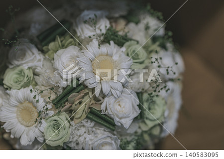 A bouquet made of white gerberas and roses. A bouquet made of white gerberas and roses. 140583095