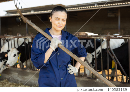 Asian woman farmer with pitchforks on farm Asian woman farmer with pitchforks on farm 140583189