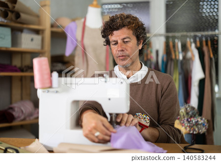 Man tailor at work Man tailor at work 140583244
