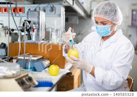 Female scientist working in food testing laboratory Female scientist working in food testing laboratory 140583328