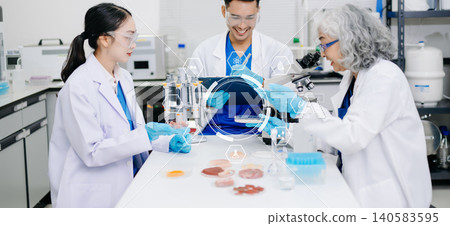 Asian Scientists Collaborating in Medical Laboratory with Futuristic Digital Interface 140583595