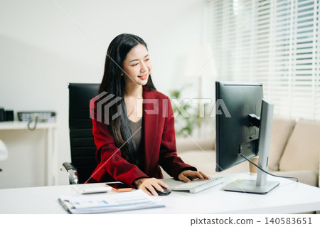 Business woman using tablet and laptop for doing math finance on an office desk, tax, report, accounting, statistics, and analytical research concept in office Business woman using tablet and laptop for doing math finance on an office desk, tax, report, accounting, statistics, and analytical research concept in office 140583651