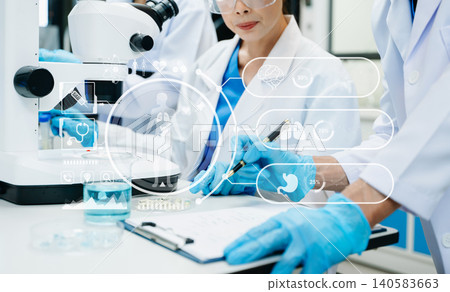 Scientist Team Working in Medical Laboratory with Futuristic HUD Interface Scientist Team Working in Medical Laboratory with Futuristic HUD Interface 140583663