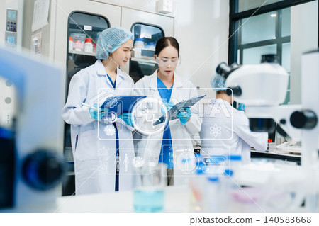 Medical scientists performing biotechnology laboratory research with DNA molecular analysis Medical scientists performing biotechnology laboratory research with DNA molecular analysis 140583668