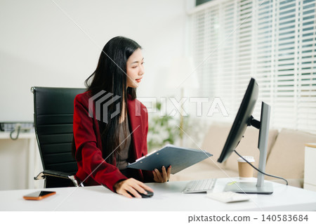 Business woman using tablet and laptop for doing math finance on an office desk, tax, report, accounting, statistics, and analytical research concept in office Business woman using tablet and laptop for doing math finance on an office desk, tax, report, accounting, statistics, and analytical research concept in office 140583684