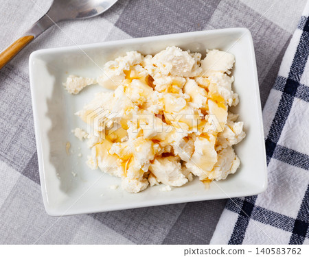 Soft whey cheese mato from goat milk with honey Soft whey cheese mato from goat milk with honey 140583762