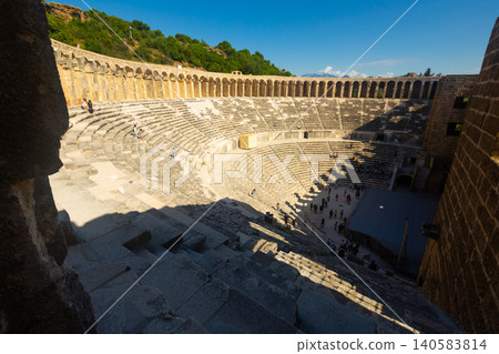 Ancient amphitheater Aspendos a sunny summer day. Antalya. Turkey Ancient amphitheater Aspendos a sunny summer day. Antalya. Turkey 140583814